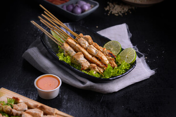 Ponorogo, East Java, Indonesia on March 22, 2021. Rabbit satay food introduces its sales product. Sellers create catalogs by documenting them to attract buyers' attention.