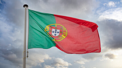 Portugal flag waving against cloudy sky