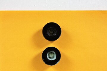 two caps on the yellow background