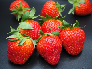strawberries on a black background