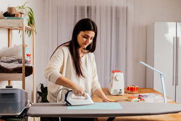 Process of ironing textile before cutting the pattern and sewing