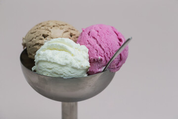 Vanilla, chocolate and berry scoops of ice-cream