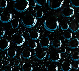 Water droplets on black background..
