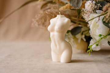 Beautiful candle in the shape of a human body