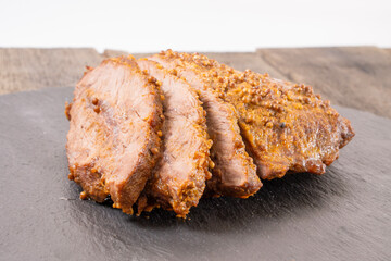 baked beef on a cutting board. food concept