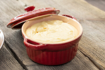 French fries with cheese sauce on wooden background. food concept