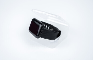 new smart fitness bracelet with blank black screen in a transparent plastic box