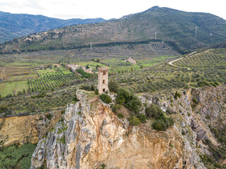 Fototapeta na wymiar Ancient tower on the cliff of a small hill, Tuscany, Italy