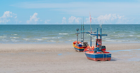 A fishing boat moored on the beach. They are 2 small boats that fish on the coast not too far from the sea.