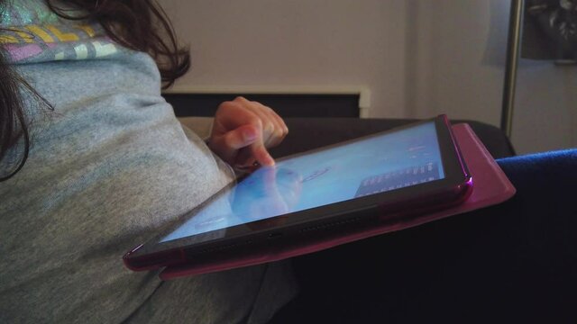 Girl playing on a tablet	