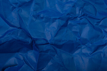 Bright crumpled paper blue color texture background