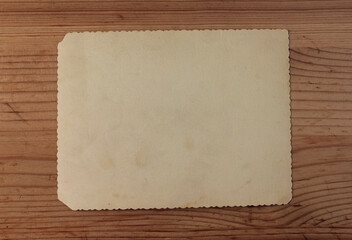 White vintage paper on a wooden background.
