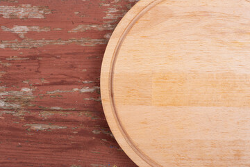 Fototapeta premium Cutting board for cutting bread, pizza or steak on a wooden background.
