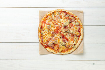 Delicious pizza on white wooden table. Pizza delivery. Pizza menu. Space for text.