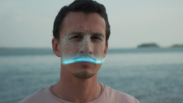 Modern Technology Using Facial Recognition Biometrics People. Person Face Id. Young Handsome Man Looking at Camera and Hi-tech Detection Portrait. 3d Scanned Cyber Security Protection Close-up 4k Shot