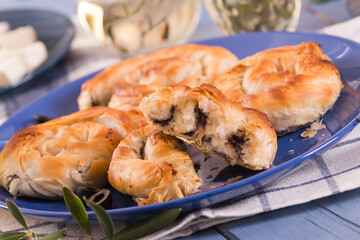 Pastry swirls with cheese and olive filling.
