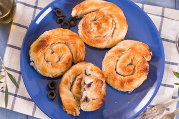 Pastry swirls with cheese and olive filling.
