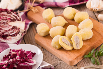 Potato gnocchi stuffed with radicchio and ricotta.
