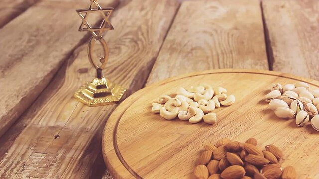 the hands of a man and a woman put nuts on the board, put wine for Kiddush, put burlap three leaves of matzo