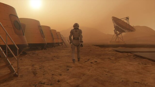 Astronaut on the planet Mars, making a detour around his base. Astronaut walking along the base. Small dust storm. The satellite dish sends data to the ground. Realistic 3D animation