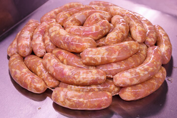 Raw chicken farm sausages for grilling and barbecue