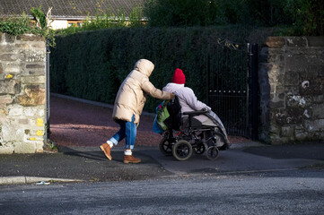 Senior elderly vulnerable person in wheelchair for mobility