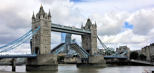 Fototapeta na wymiar A view of Tower Bridge opening its drawbridge