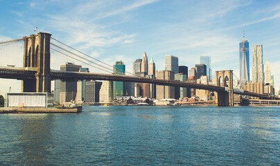 Fototapeta premium Brooklyn bridge with cityscape of Lower Manhattan skyscrapers skylines bulding New York City. Lower Manhattan is the largest financial district in the world.