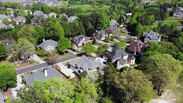 Aerial 4K video of cluster of houses in an upscale sub division in suburbs of USA