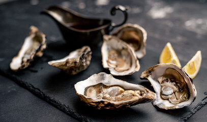 Oysters with lemon on platter