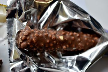 Delicious chocolate bar with nuts in a package