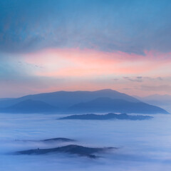 Fototapeta na wymiar misty mountain valley at the twilight