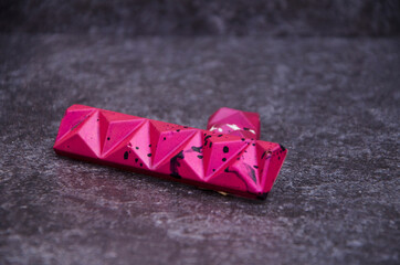 Chocolate bar decorated in bright fuchsia colors.
