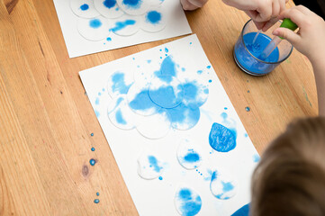 Let's make the rain. Boy coloring drop shape cotton pads. 5 minute crafts for children activities....