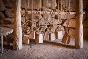 detail of an ancient wooden loom on a rustic house