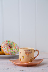 pink coffee cup and bagels 