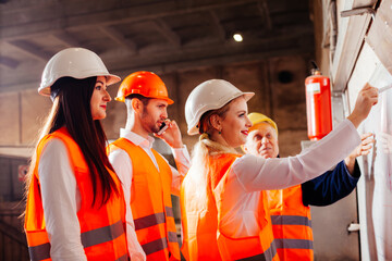The workers draw up a plan of work at the plant