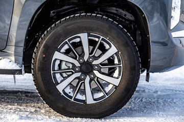 Wheel. Cast wheel with tires close-up. Worn on an SUV. winter, snow on wheels.