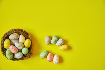Easter eggs on yellow background. Happy Easter. Holiday concept. Focus on eggs.