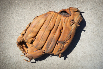Old worn baseball and softball gloves