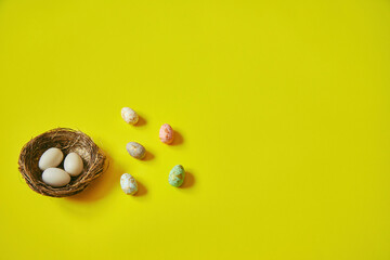 Easter eggs on yellow background. Happy Easter. Holiday concept. Focus on eggs.
