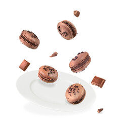 Levitation of french pastries chocolate macarons on white background.