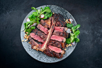 Modern style traditional barbecue dry aged wagyu porterhouse beef steak bistecca alla Fiorentina...