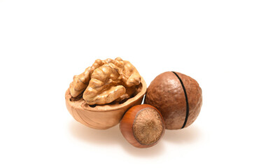 Three nuts on isolated white background close up