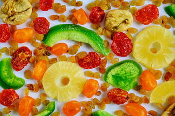 Multi-colored dried fruits are on the table