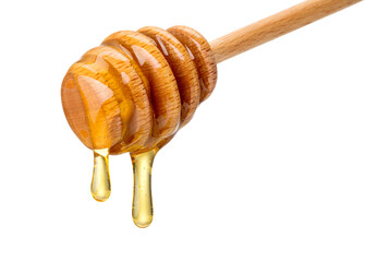 honey dripping from a wooden dipper