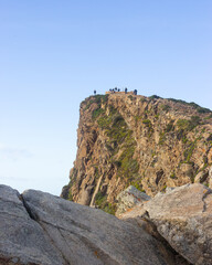 beautiful view on the pic of the hill with people