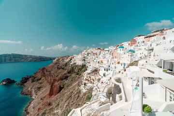 Nice view on church with blue domes and Oia village Santorini island, Greece