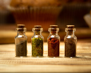 pepper salt paprika and cocoa in bottles