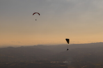 Dramatic paragliding duo with beautiful scenery